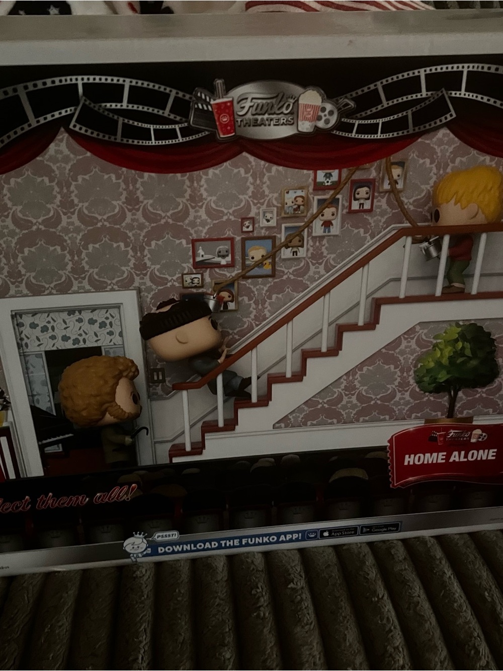 Funko Home Alone Theater Display with Red Curtains and White Staircase